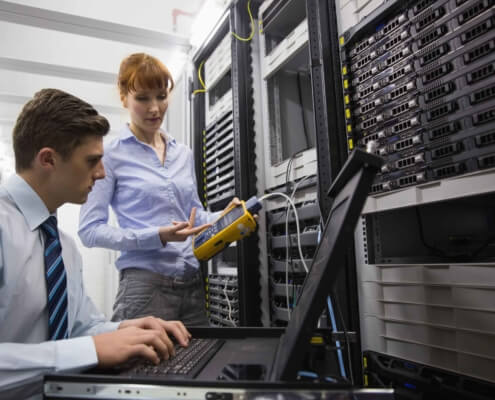 people in server room working