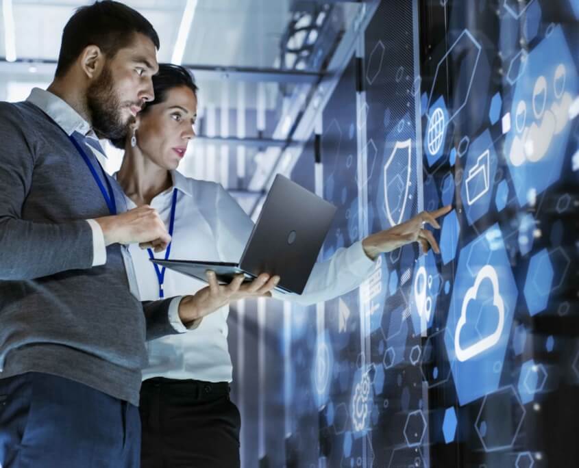 two people in server room working together